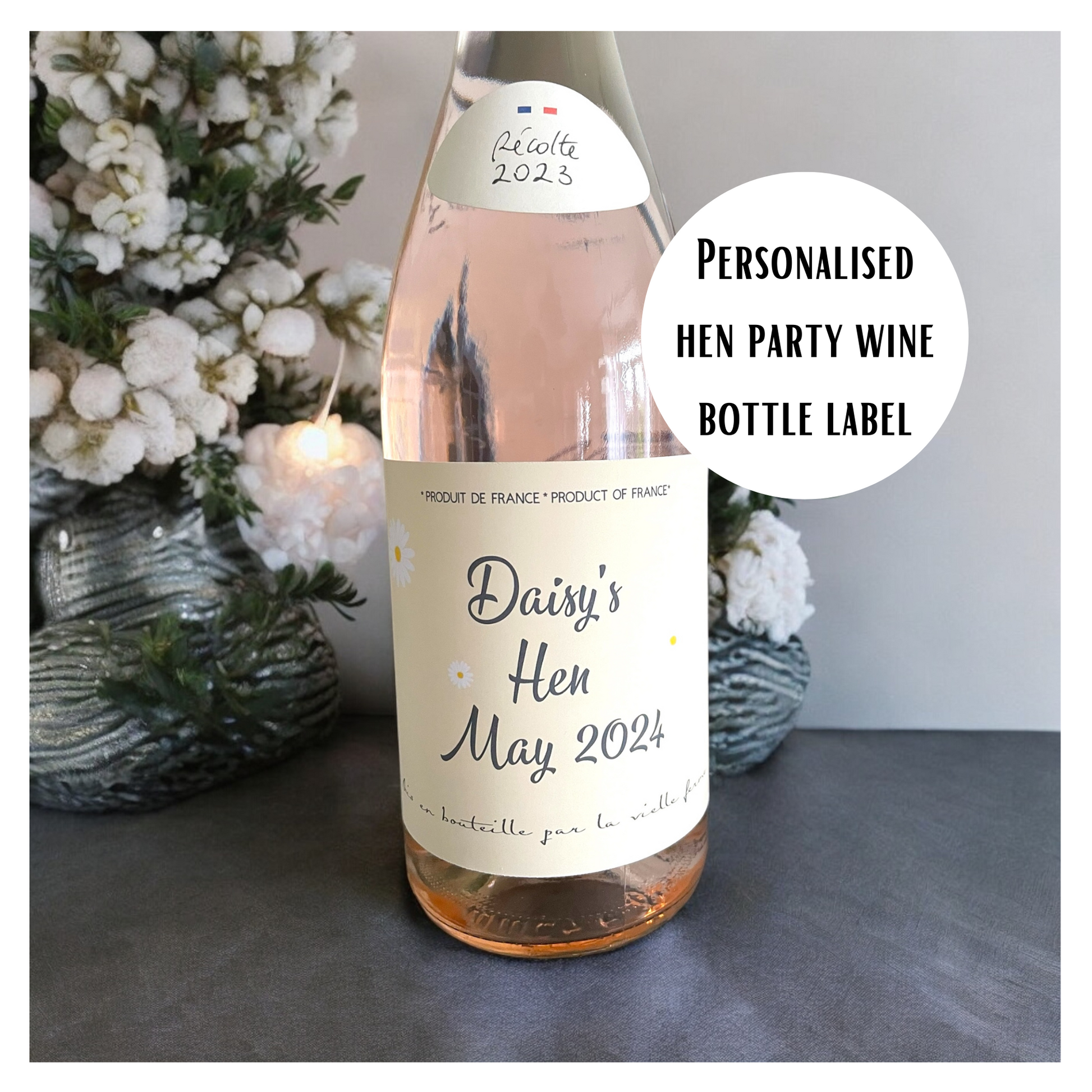 Hen Party Personalised La Vieille Ferme Rose wine bottle label pictured on  a table with white flowers in baskets in the background